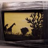 Silhouette of African giraffes at sunset by Vicky Van Staden