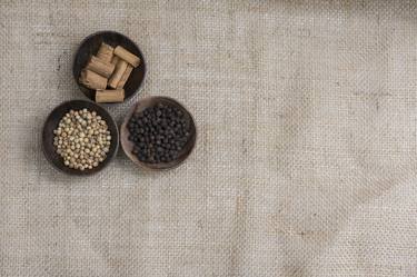 Three spices (cinnamon, pepper, coriander) in bowls lying on jute - Limited Edition 1 of 15 thumb