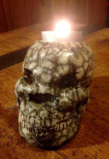 Candle skull thumb