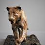 This sculpture was inspired by a lioness I photographed and tracked in South Africa's Kruger National Park. She was in superb condition and exuded a raw, fluid power.The patina of gold and browns creates a marbled effect to reflect the tawny coat of the lioness.

Ltd Ed 12