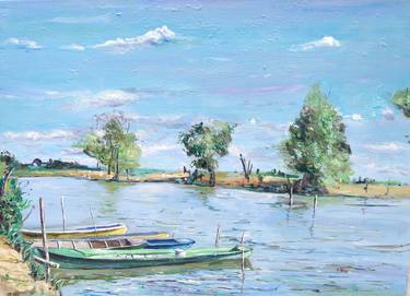 Boats on the river bank thumb