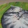 My favorite cat, Kitty, sleeps on a striped rug. The picture was painted on a ground canvas (on cardboard) with a diameter of 40 cm.