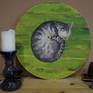 My favorite cat, Kitty, sleeps on a striped rug. The picture was painted on a ground canvas (on cardboard) with a diameter of 40 cm.