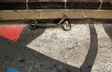 Carbonized and abandoned scooter on a street in the capital (Paris France). thumb
