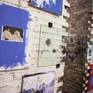 This artwork combines abstract acrylic painting with pieces of magazines, newspapers and image of american flag.