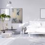 Neutral abstract artwork in a bright bedroom