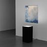 Blue and white abstract painting in a modern gallery space