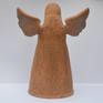 Angel wrap in fire clay finished with metal oxide glaze and porcelain.