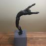 Have you ever won a race and flung your arms up in the air?This sculpture captures that moment of victory in time.