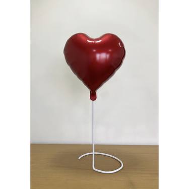 Red heart foil balloon thumb