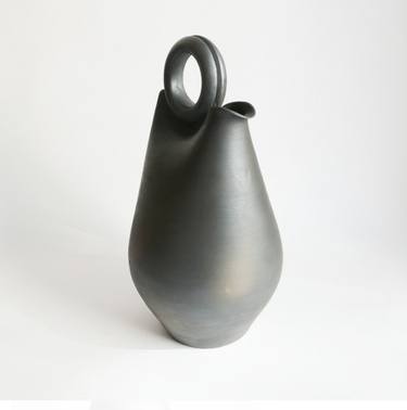 The silhouette of our carafe is inspired by traditional gourds, designed to keep water cool. thumb