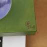 the picture has a wooden frame
and there are separate attachments to it