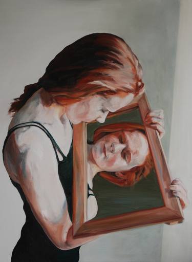 Adolescent girl looking in mirror thumb