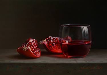 Pomegranate with a glass thumb