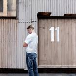 Boy Outside Number 11 by Rex Turnbull