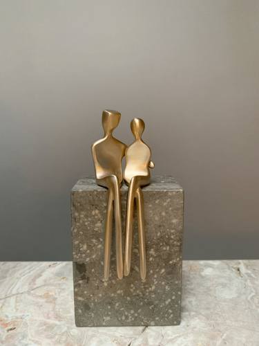Caress in brushed bronze on gray limestone thumb