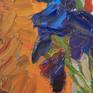 Composition with blue irises on red chair in art studio.