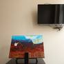 Original on easel next to tv