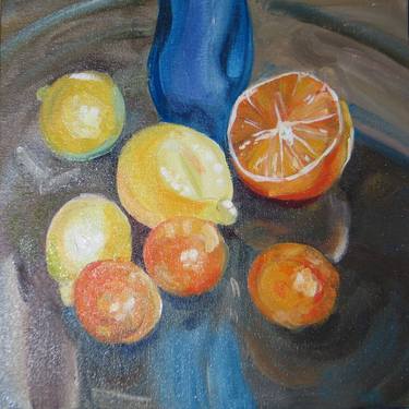Lemons & oranges with blue thumb