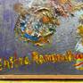 Photo showing signature by artist with acrylic paint color used in the painting, at bottom left corner of the painting.