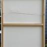 Reverse view of stretched canvas, wired and ready to hang.