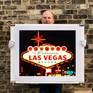 Richard holding Welcome Las Vegas print