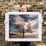 Richard Heeps holding print of One Tree Hill.