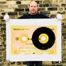Richard holding Heidler and Heeps tape collection Chrome Tutti Frutti print.