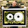 Richard holding Heidler and Heeps tape collection Yellow Tinted Cassette print.