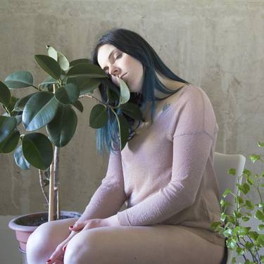 Portraits of young girl with Ficus thumb