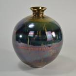 Spherical vessel with gold lustre by Timothy White