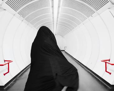 alone woman goes to white tunnel with islamic hijab thumb