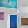 A collection of Glass Cathedral dioramas hanging on the wall