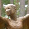 The face of Icarus II in bronze.