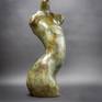 Bronze female torso abstract. Greens and browns.
