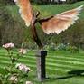 Bronze sculpture of Icarus in garden