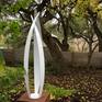 FLIGHT, contemporary abstract outdoor sculpture, white powder coated steel, weathered steel cube