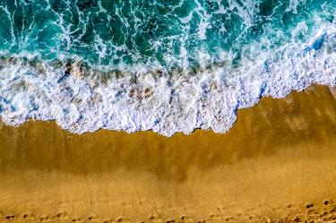 aerial view of sandy beach and small waves thumb