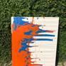 The work is inspired by the liberating ability to create something out of nothing. You can simply tap into that little God-like feature we all possess. The colors used in this piece are orange and blue with a white background, which are known to symbolize creativity, stability, joy, calmness, and would add an xfactor to a minimalistic environment.