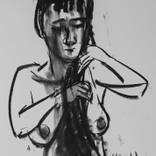woman combing her hair by mohamed khalil