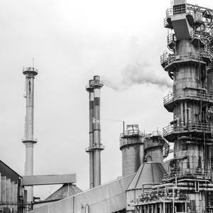 partial view of a factory with smoking chimneys - - Limited Edition of 10