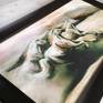 A print of a chalk drawing in a frame under matt glass of wild horses galloping free in the wild west with a warm vibe.
