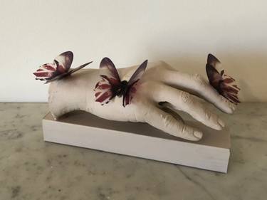 Pink Butterflies on a Hand thumb