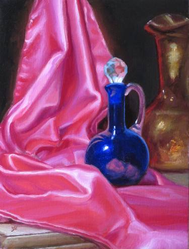 Silky red cloth with blue vinegar bottle. thumb