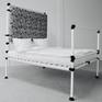 modular bed system individually constructed and made by hand. One-off. Materials: Steel tube with steel cast connections. Headboard made of wood with Japanese fabric pattern. Padded. Bed is sold without mattress and covers.