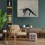 picture on a wall with chair and ornaments