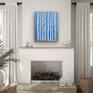 Blue Birches styled over a fireplace.
