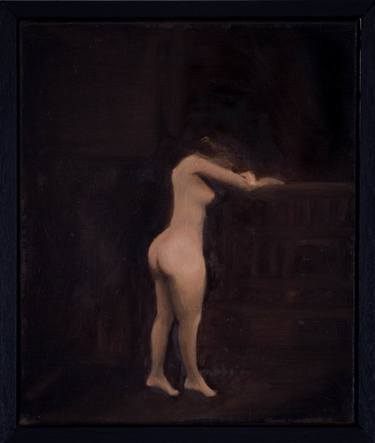 Nude woman in a dark room thumb