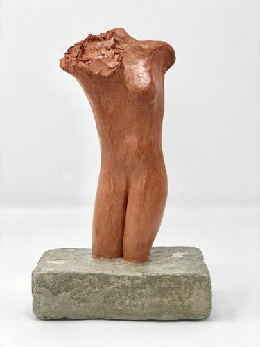 Identity, hand formed clay sculpture on concrete thumb