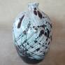 Decorative vase is made on a Potter's wheel and decorated with colored glazes. Cone 5.